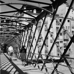 Iron pedestrian bridge over the Onyar river in Girona, Spain