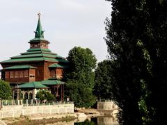 Mausoleum of Shah-e-Hamadan with intricate wooden architecture and scenic surroundings