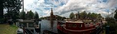 Panoramic view of Oudeschans, Montelbaanstoren in Amsterdam with surrounding canals and bridges