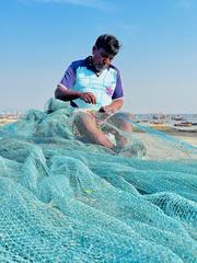 Net weaver working in Vasai Koliwada