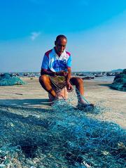 Net weaver at work in Vasai Koliwada