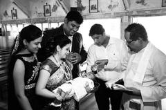 baby girl receiving the sacrament of baptism