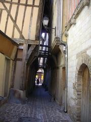 narrow medieval street in Troyes, France with timber-framed houses