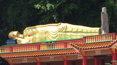 Sleeping Buddha outside a temple in Malaysia