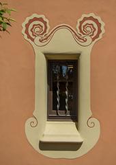 arched window with wrought iron bars in Casa Museu Gaudi