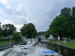 Schleuse Woltersdorf with boats in the lock chamber under a blue sky