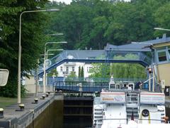 Schleuse Woltersdorf with water, boats, and trees in view