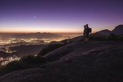 Two friends watching the advancing night with Barra da Tijuca and Jacarepaguá in the background