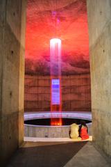 Couple sitting next to the fountain inside the Museum of Independence in Bangladesh