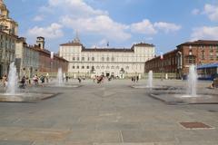 Torino, Italy cityscape with historic buildings and hills in the background