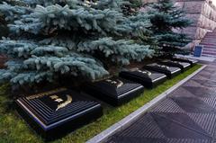 Monument to the Heroic Defenders of Leningrad with flower bed and stone slabs bearing names of hero cities