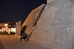 Gobindgarh Fort wall with steep stairs and two women sitting, Amritsar, India