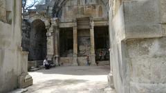 Amphitheater of Nîmes under clear blue sky