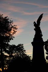 fallen angel statue in a forest