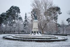 Fountain of the Fallen Angel in Madrid after snowfall