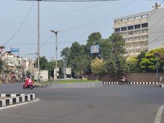 Road junction in Vizag with vehicles and greenery