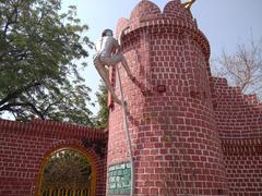 Raghavaiah Park in Vijayawada showcasing green lawns, trees, and pathways