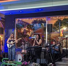 Dorothea Paas performing outside of the Yeti Cafe in Kitchener, Ontario