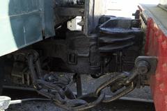 Close-up view of Janney couplings in engagement between Locomotive 306 and Presidential Saloon Car on uneven exhibition track