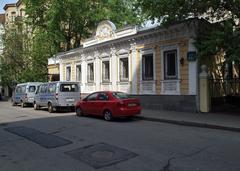 Burdenko Street in Moscow on a clear day with buildings and parked cars