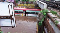 Bus in flooded street in Mathura, Uttar Pradesh