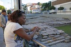 visitors observing Cais do Valongo in Rio de Janeiro