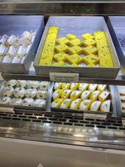 A display of various colorful Indian sweets