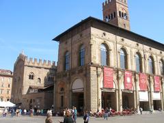 Bologna cityscape featuring historical buildings and a distant view of hills