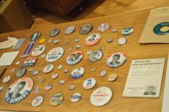 John F. Kennedy Presidential Library exhibit with 1960 campaign buttons on display