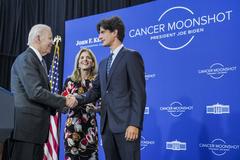 President Joe Biden greets Ambassador Caroline Kennedy and her son John 'Jack' Schlossberg after delivering remarks on the Cancer Moonshot at the John F. Kennedy Presidential Library and Museum