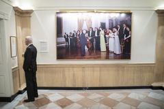 President Joe Biden looks at Kennedy family photos and documents at the John F. Kennedy Presidential Library and Museum