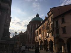 Piazza Garibaldi in Vicenza at sunset with the cathedral dome