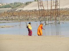 Dwaraka temple with pilgrims and surrounding landscape