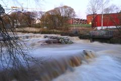 Fast-flowing Vantaanjoki River in Vanhakaupunki, Helsinki after a wet December