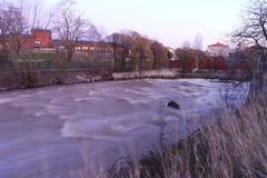 Vantaanjoki river flowing rapidly in Vanhakaupunki, Helsinki