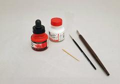 acrylic paint and tools for numbering museum objects