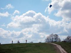 Kiting at Parliament Hill on a clear day with people flying kites