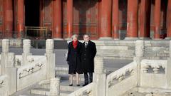 Prime Minister in China shaking hands with officials