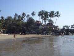 Sunset at Palolem Beach with boats on the shore