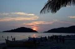 Perfect evening at Palolem Beach, Goa with ships, palm trees at dusk