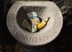 stone sculpture 'Give if you can - Take if you have to' by Jacek Tylicki in Palolem Island, Goa, India