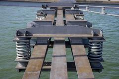 Seesaw mass-spring-damper system on Passerelle des Deux-Rives