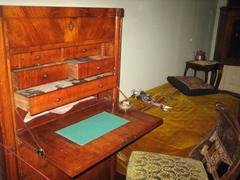 Anna Akhmatova's writing desk with her authentic letters defending her repressed son L. Gumilyov on display.