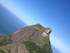 Pedra Bonita mountain with lush greenery and blue sky