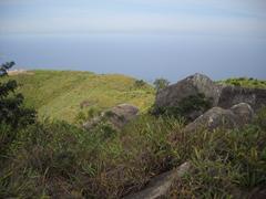 Scenic coastal view with blue sea and rocky headland