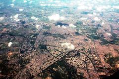 Aerial view of Rajnagar area in Ghaziabad and Delhi metropolitan area with Yamuna River and clouds