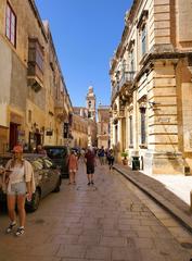 A narrow street with limestone buildings in Mdina, Malta