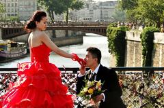 a man kissing a woman's hand in a formal setting