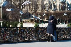 A couple on the Pont de l'Archevêché, Paris