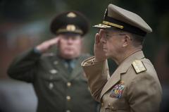 U.S. Navy Adm. Mike Mullen rendering honors during U.S. national anthem